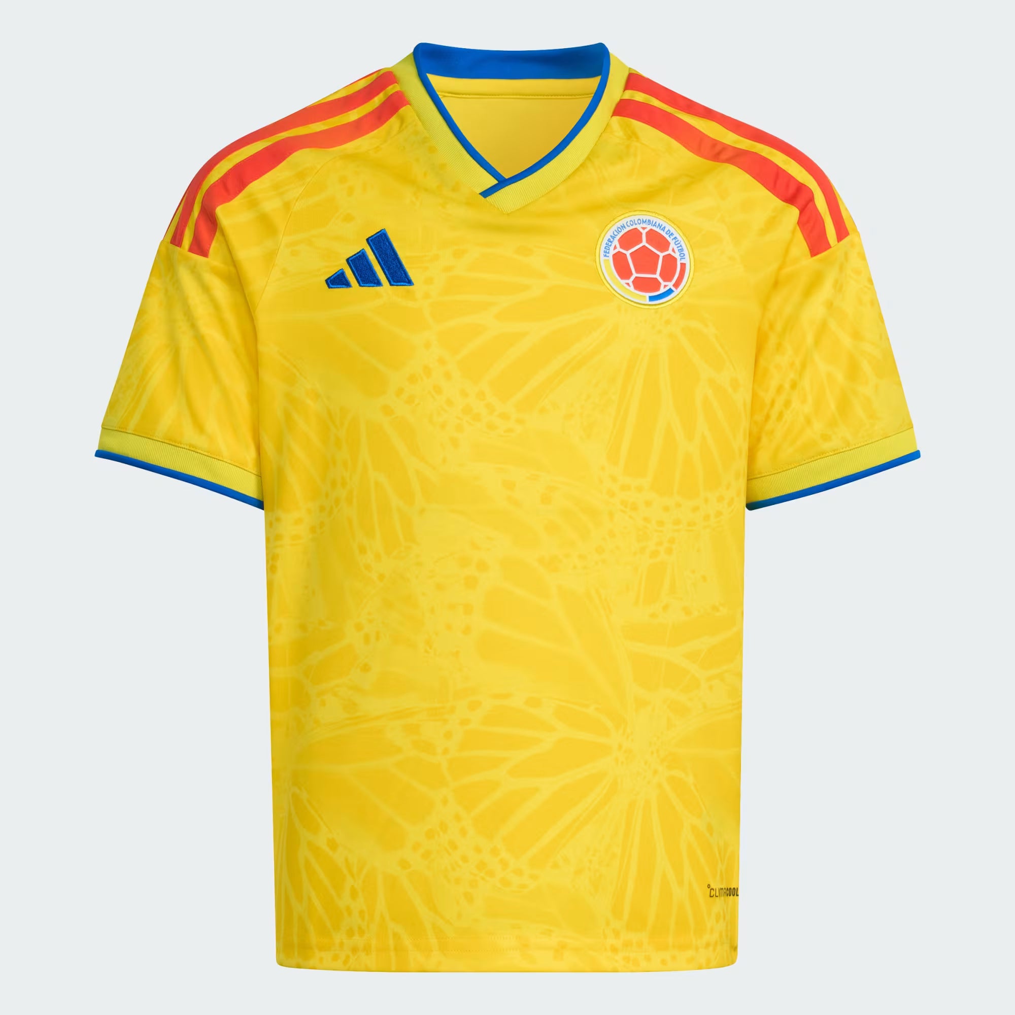 Yellow soccer jersey with red and blue accents, featuring Adidas logo and Colombian flag emblem on a white background.