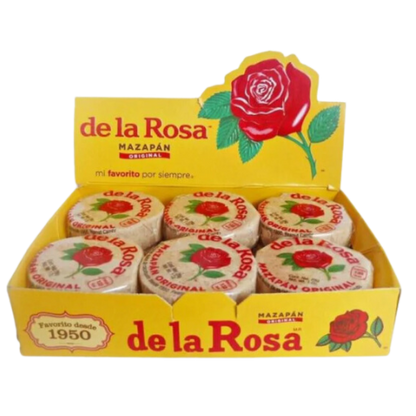 "Group of Mazapan candies arranged in a pile, showcasing their beige color and unique shape."