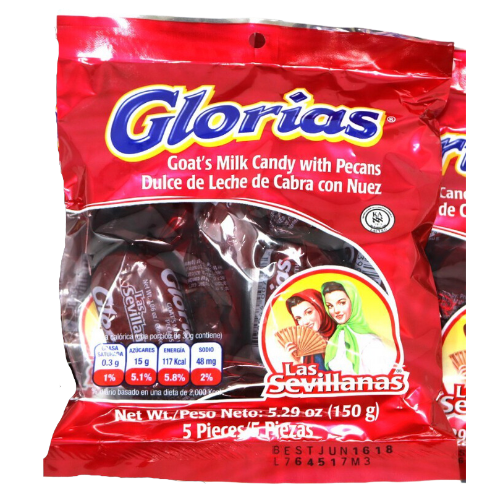 A close-up photo of a rectangular box with a red background and a yellow border. The box has a picture of a woman in traditional Spanish dress, holding a plate of candy. The candy is called "Glorias" and is made of a sticky, chewy mixture of milk and sugar, with a peanut in the center. The box is labeled "Las Sevillanas" in large, bold letters at the top