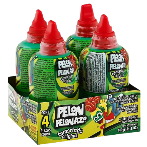 A photo of a clear plastic bottle filled with a brownish-red sticky liquid, with a label that reads "Pelon Pelonazo Tamarindo." The bottle has a green cap and is tilted to the side, with the liquid pouring out in a stream. In the background, there are blurred images of other products on a store shelf.